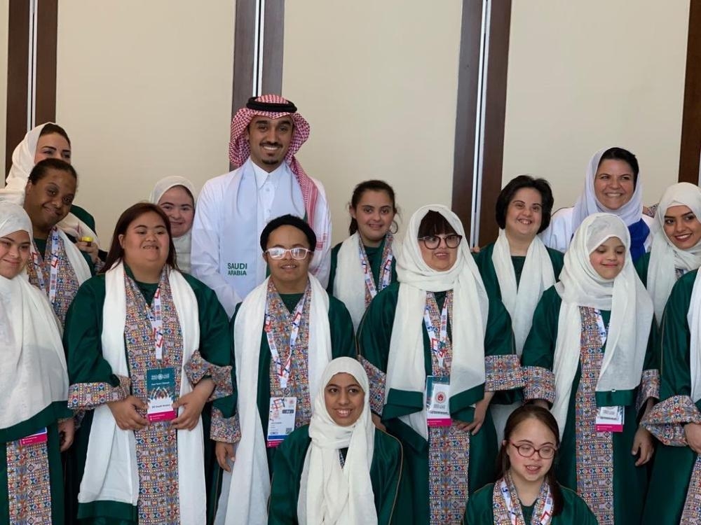 Prince Abdul Aziz Bin Turki Al-Faisal, chairman of the board of directors of the General Authority of Sports, poses for a photo with the Saudi team members taking part in the Special Olympics World Games in Abu Dhabi on Thursday. — SPA