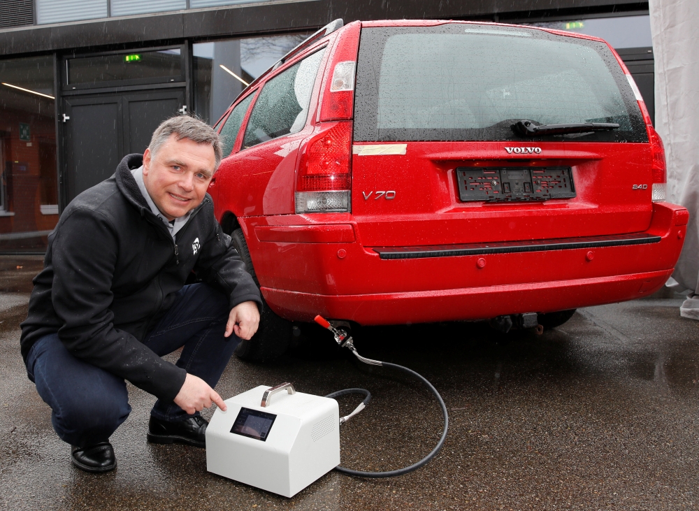 Senior global product manager Juergen Spielvogel of US instruments manufacturer TSI demonstrates the use of a new TSI-PET device to test the effectiveness of particle filters of cars during a meeting of engineering group VERT in Duebendorf, Switzerland, Thursday. — Reuters
