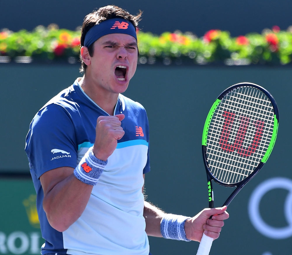 Milos Raonic (CAN) celebrates match point as he won his quarterfinal match against Miomir Kecmanovic (not pictured) in the BNP Paribas Open at the Indian Wells Tennis Garden. — Reuters