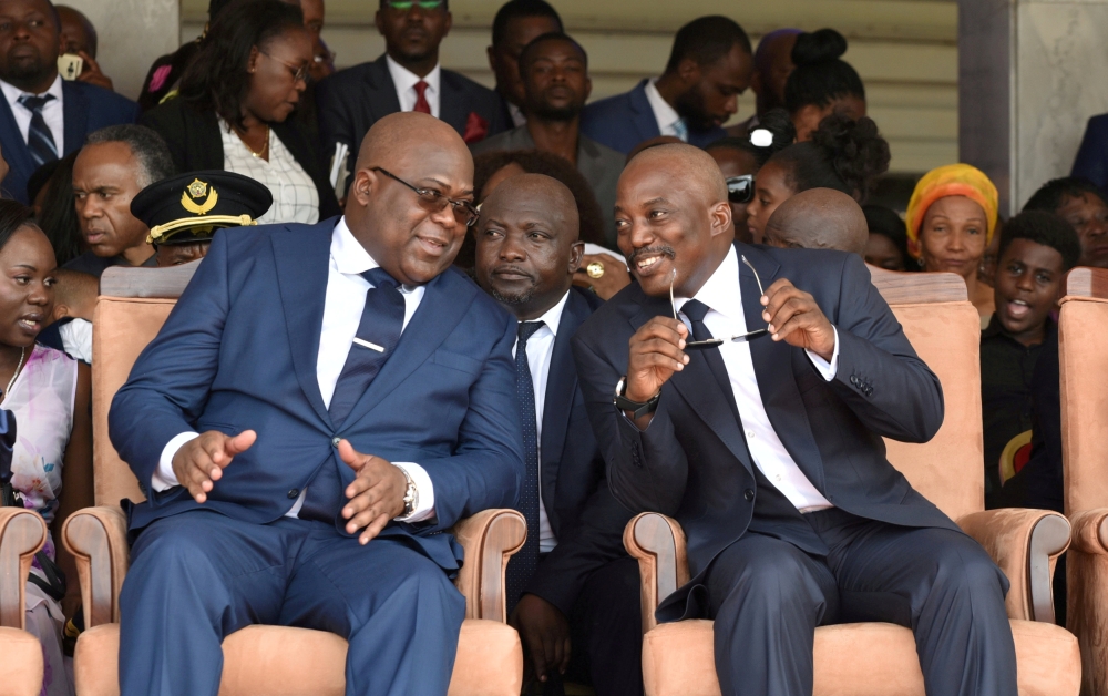 Democratic Republic of Congo’s outgoing President Joseph Kabila sits next to his successor Felix Tshisekedi during the inauguration ceremony in this Jan. 24, 2019 file photo. — Reuters