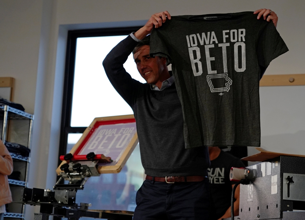 Democratic 2020 presidential candidate Beto O'Rourke, 46, holds up a “Iowa For Beto” screen-printed shirt at Raygun clothing store during a three day road trip across Iowa, in Cedar Rapids, Iowa, in this March 15, 2019 file photo. — Reuters