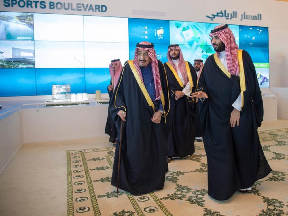 Custodian of the Two Holy Mosques King Salman being briefed by Crown Prince Muhammad Bin Salman, deputy premier and minister of defense, on the salient features of the four mega projects during an inauguration ceremony in Riyadh on Tuesday. — SPA