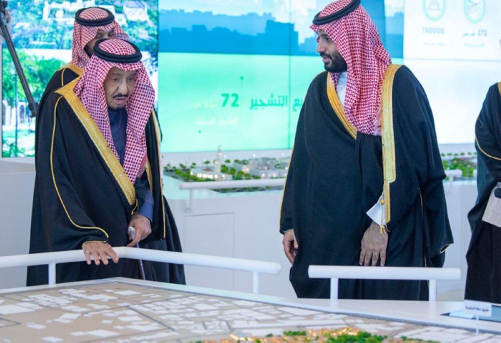 Custodian of the Two Holy Mosques King Salman being briefed by Crown Prince Muhammad Bin Salman, deputy premier and minister of defense, on the salient features of the four mega projects during an inauguration ceremony in Riyadh on Tuesday. — SPA