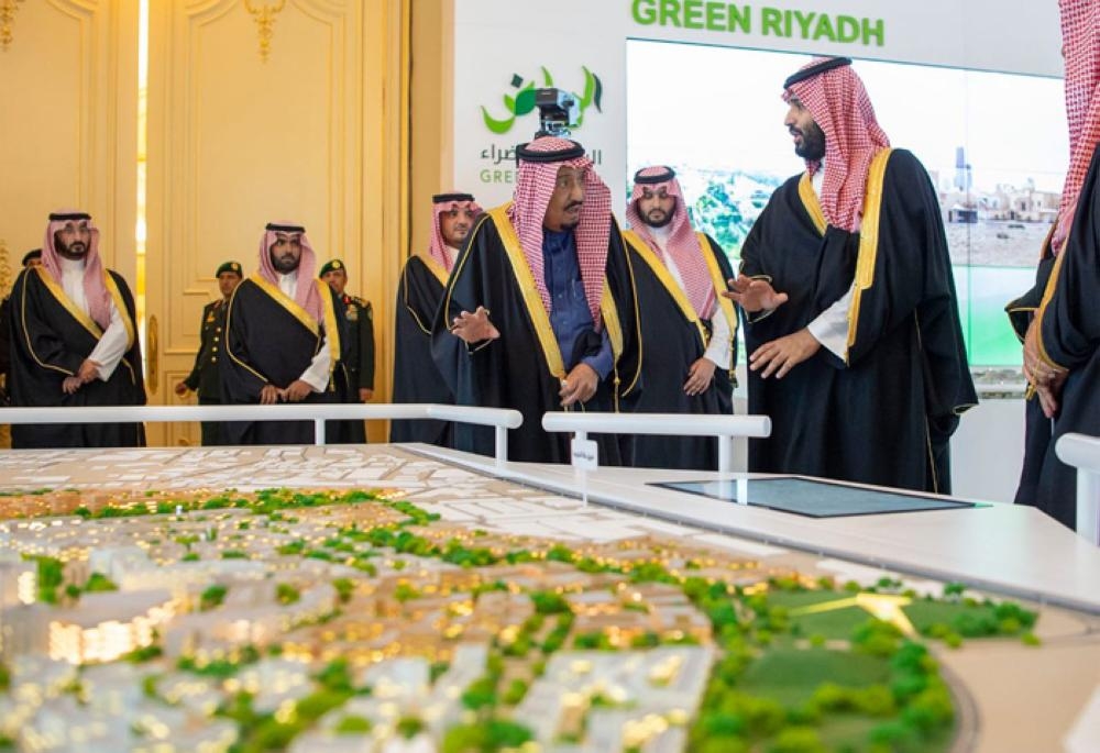 Custodian of the Two Holy Mosques King Salman being briefed by Crown Prince Muhammad Bin Salman, deputy premier and minister of defense, on the salient features of the four mega projects during an inauguration ceremony in Riyadh on Tuesday. — SPA
