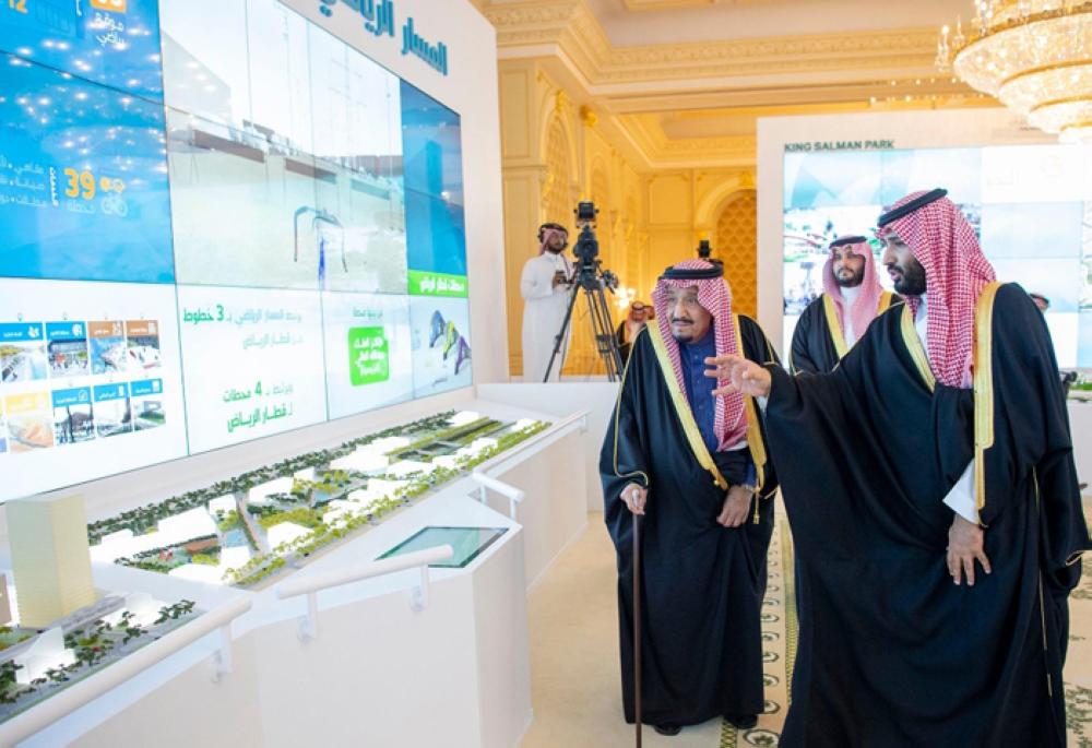 Custodian of the Two Holy Mosques King Salman being briefed by Crown Prince Muhammad Bin Salman, deputy premier and minister of defense, on the salient features of the four mega projects during an inauguration ceremony in Riyadh on Tuesday. — SPA