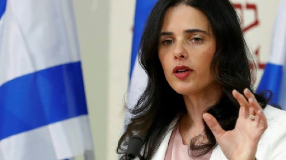 


 A social media campaign ad for Israeli Justice Minister Ayelet Shaked’s far-right New Right party has her unapologetically wearing a perfume called “Fascism”. — AFP 