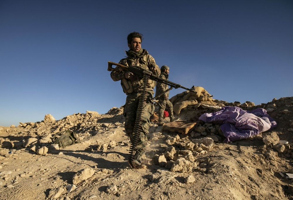 


Syrian Democratic Forces fighters keep position at a hilltop overlooking Daesh (so-called IS) group’s last remaining location in the village of Baghouz during battles with the Kurdish-led SDF in the countryside of the eastern Syrian province of Deir Ez-Zor. — AFP