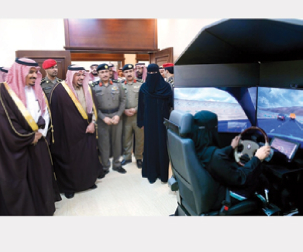 


Emir of Qassim Prince Faisal Bin Mishaal and Director General of Traffic Maj. Gen. Mohammed Al-Bassami watch as a woman trains at the newly launched driving school at Qassim University.