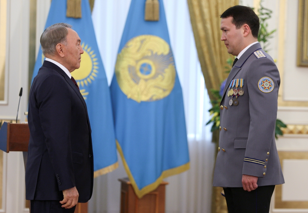 Kazakh President Nursultan Nazarbayev, left, and Deputy Chairman of the National Security Committee Samat Abish attend an awarding ceremony in Astana, Kazakhstan, in this May 6, 2014 file photo. — Reuters
