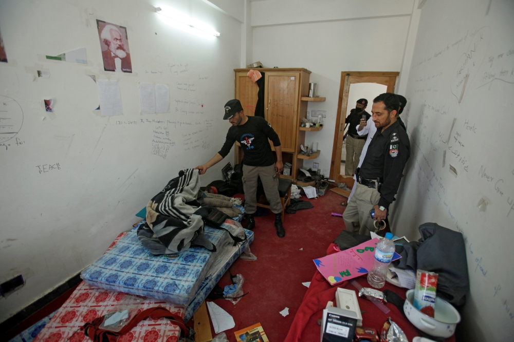 Police search the dorm room of Mashal Khan, accused of blasphemy, who was killed by a mob at Abdul Wali Khan University in Mardan, Pakistan, in this April 14, 2017 file photo. — Reuters