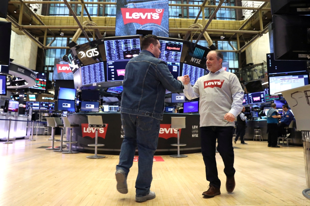 Traders wear Levis clothing ahead of the Levi Strauss & Co. IPO on the floor of the New York Stock Exchange (NYSE) in New York, US, Thursday. — Reuters