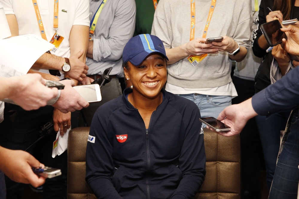 MIAMI GARDENS, FLORIDA - MARCH 20: Naomi Osaka of Japan fields questions from the media at a player availability session on Day 3 of the Miami Open Presented by Itau on March 20, 2019 in Miami Gardens, Florida.   Michael Reaves/Getty Images/AFP
== FOR NEWSPAPERS, INTERNET, TELCOS & TELEVISION USE ONLY ==
