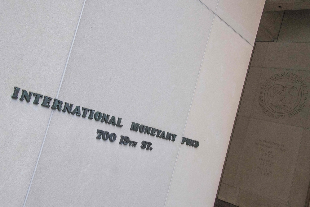 In this file photo, the International Monetary Fund (IMF) is seen in Washington, DC.  The IMF on Thursday, said the US economic outlook remained 