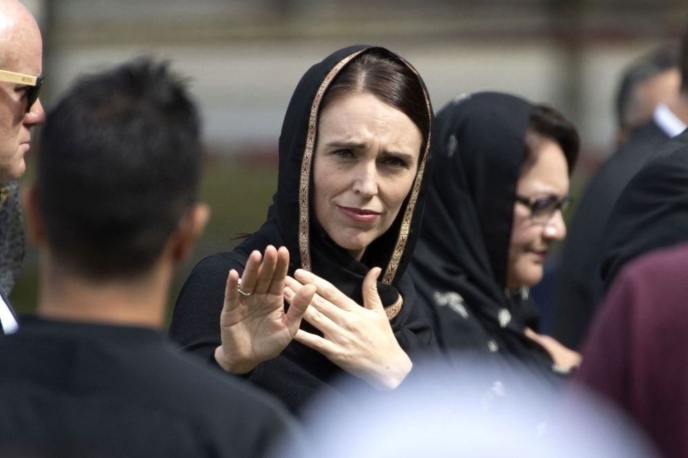 New Zealand’s Prime Minister Jacinda Ardern gestures as she departs following a gathering for congregational Friday prayers and two minutes of silence for victims of the twin mosque massacre, at Hagley Park in Christchurch, on Friday. — AFP