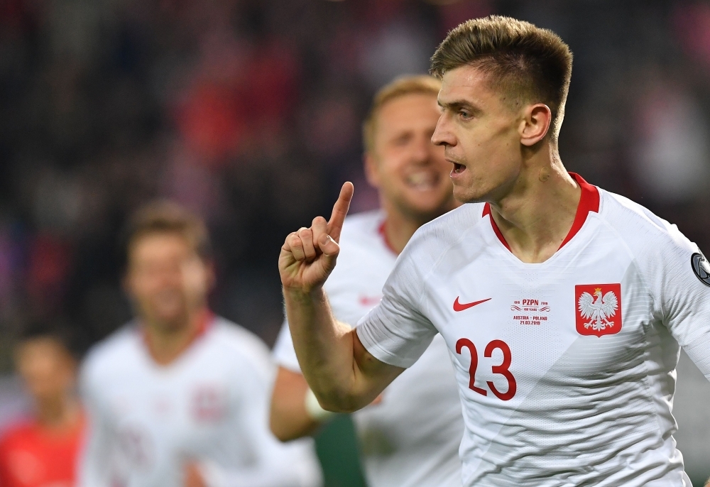 Poland's forward Krzysztof Piatek celebrates scoring the opening goal during the UEFA Euro 2020 Group B qualification football match between Austria and Poland in Vienna on Thursday. — AFP