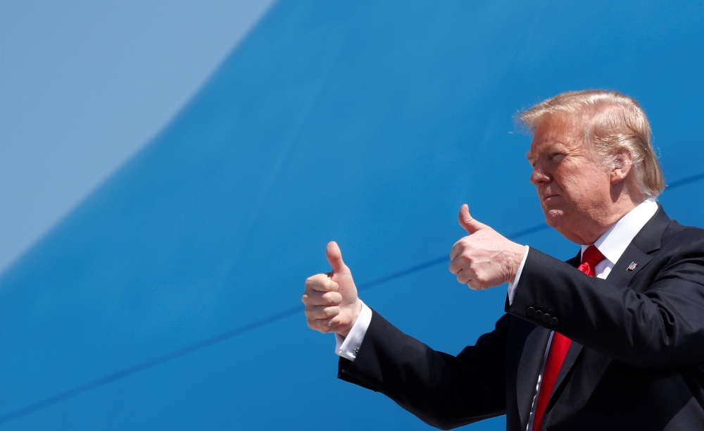 US President Donald Trump steps from Air Force One as he arrives in West Palm Beach, Florida, on Friday. — Reuters