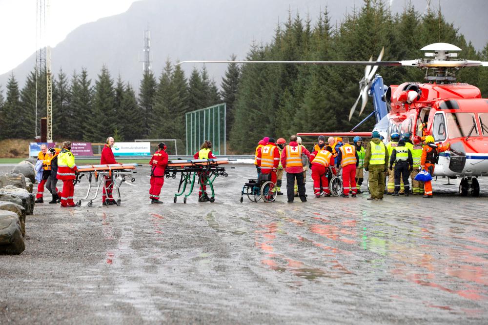 


Passengers are helped out of a rescue helicopter after being rescued from cruise ship Viking Sky in Hustadvika, Norway, Sunday. — Reuters