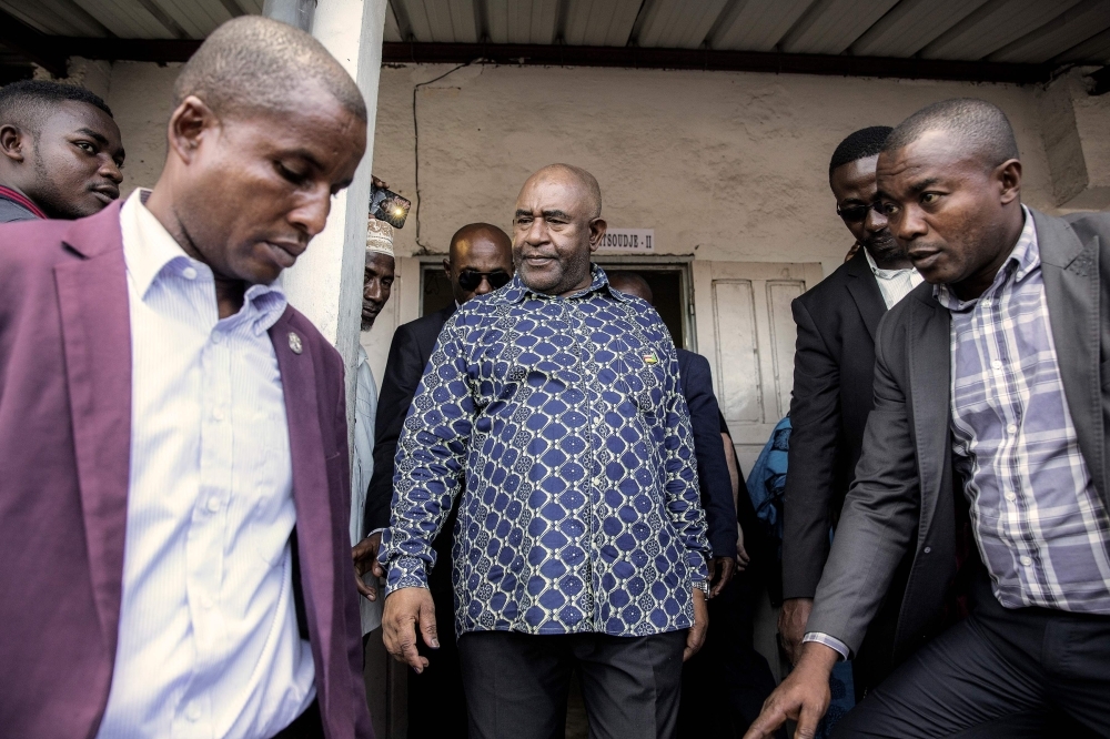 Comoros incumbent president and presidential candidate Azali Assoumani leaves a polling station after casting his ballot for the presidential election in Mitsoudje, Sunday. — AFP