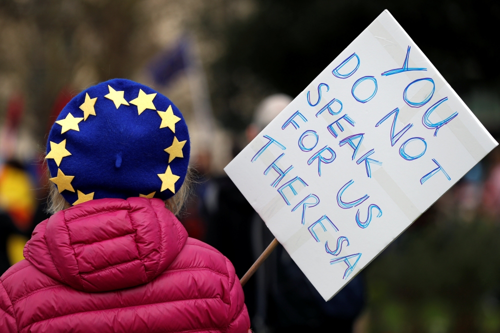 An EU supporter, calling on the government to give Britons a vote on the final Brexit deal, participates in the 'People's Vote' march in central London. — Reuters