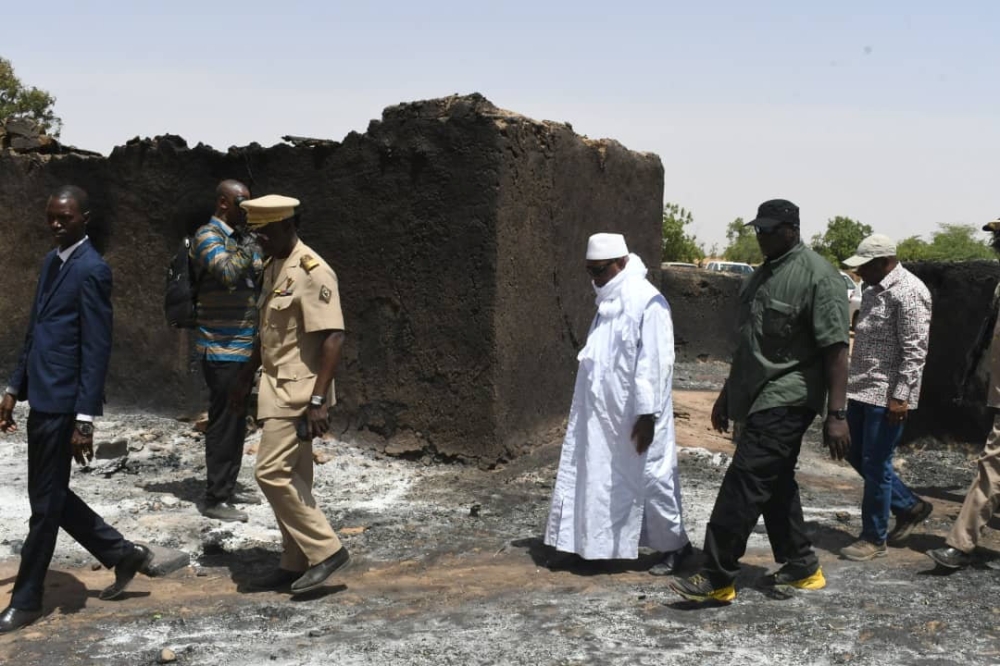 Mali’s President Ibrahim Boubacar Keita inspects the site of an attack by gunmen on Fulani herders in Ogossagou, Mali, on Monday. — Reuters