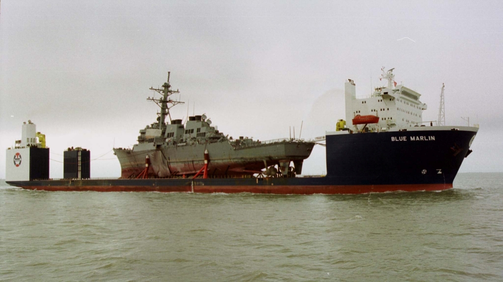 The Norwegian heavy transport ship the Blue Marlin carries the damaged USS Cole through the Mississippi Sound toward the Litton Ingalls Shipbuilding facility in Pascagoula, Mississippi, in this Dec. 13, 2000 file photo. — Reuters