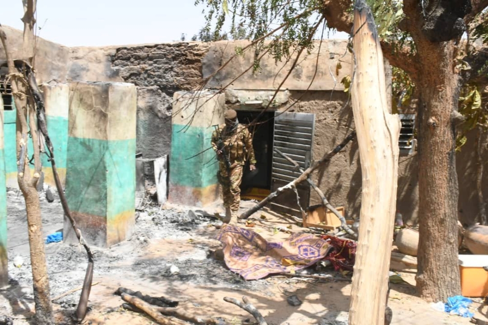 A soldier walks amid the damage after an attack by gunmen on Fulani herders in Ogossagou, Mali, in this March 25, 2019 file photo. — Reuters