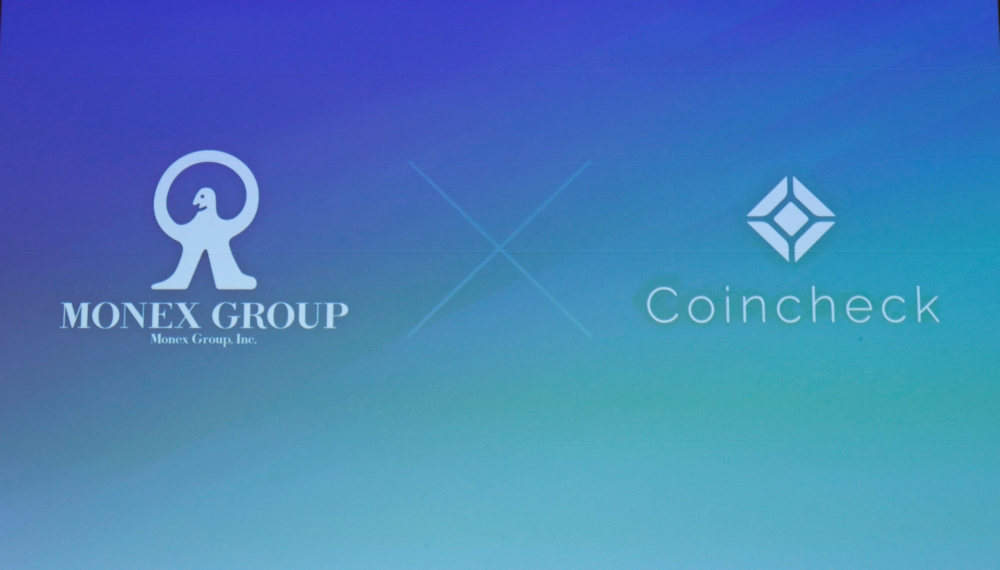 File photo of logos of Monex Group Inc and Coincheck are seen before their joint news conference in Tokyo, Japan.  — Reuters