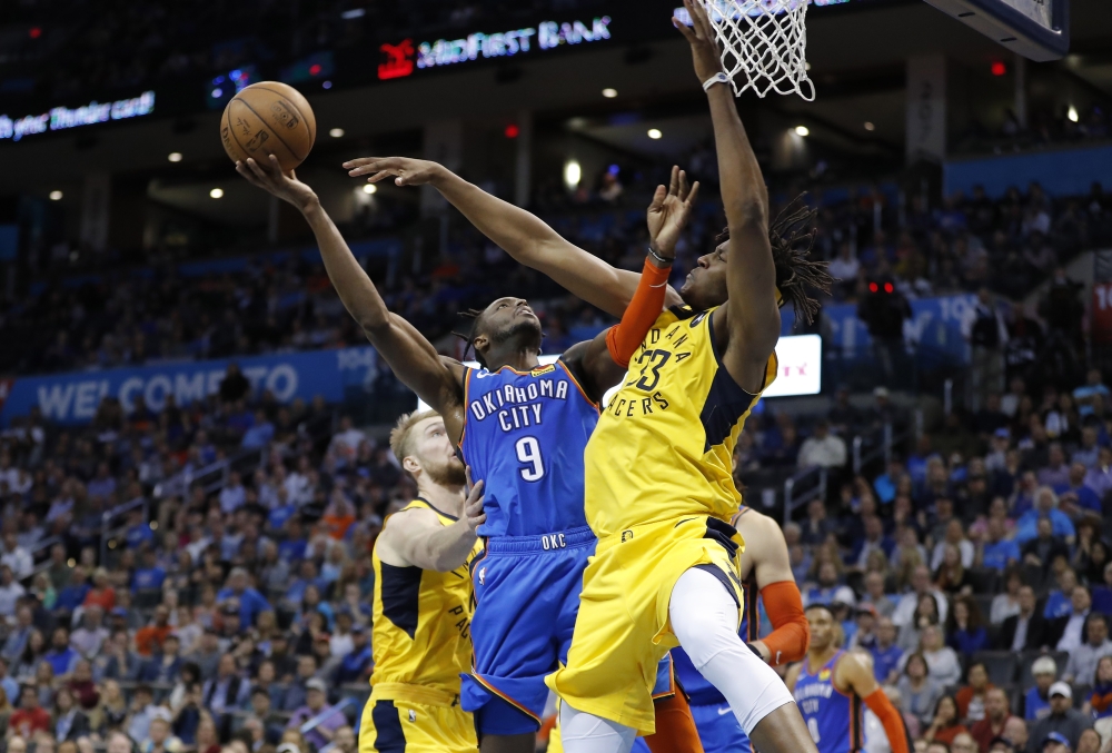 Oklahoma City Thunder forward Jerami Grant (9) goes to the basket as Indiana Pacers center Myles Turner (33) defends during the second half at Chesapeake Energy Arena. Oklahoma City won 107-99. — Reuters