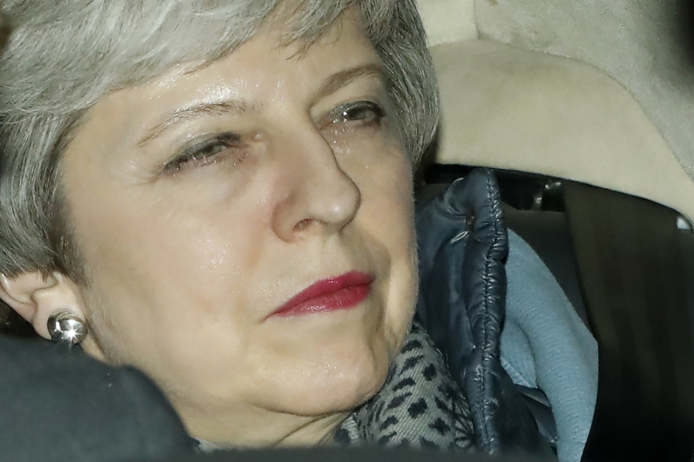Britain’s Prime Minister Theresa May leaves the Houses of Parliament in central London on Monday, after MPs voted in in the second round of indicative votes on the alternative options for Brexit. — AFP