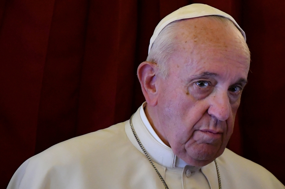 Pope Francis looks on as he addresses reporters aboard the plane bringing him back following a two-day trip to Morocco in this March 31, 2019 file photo. — Reuters
