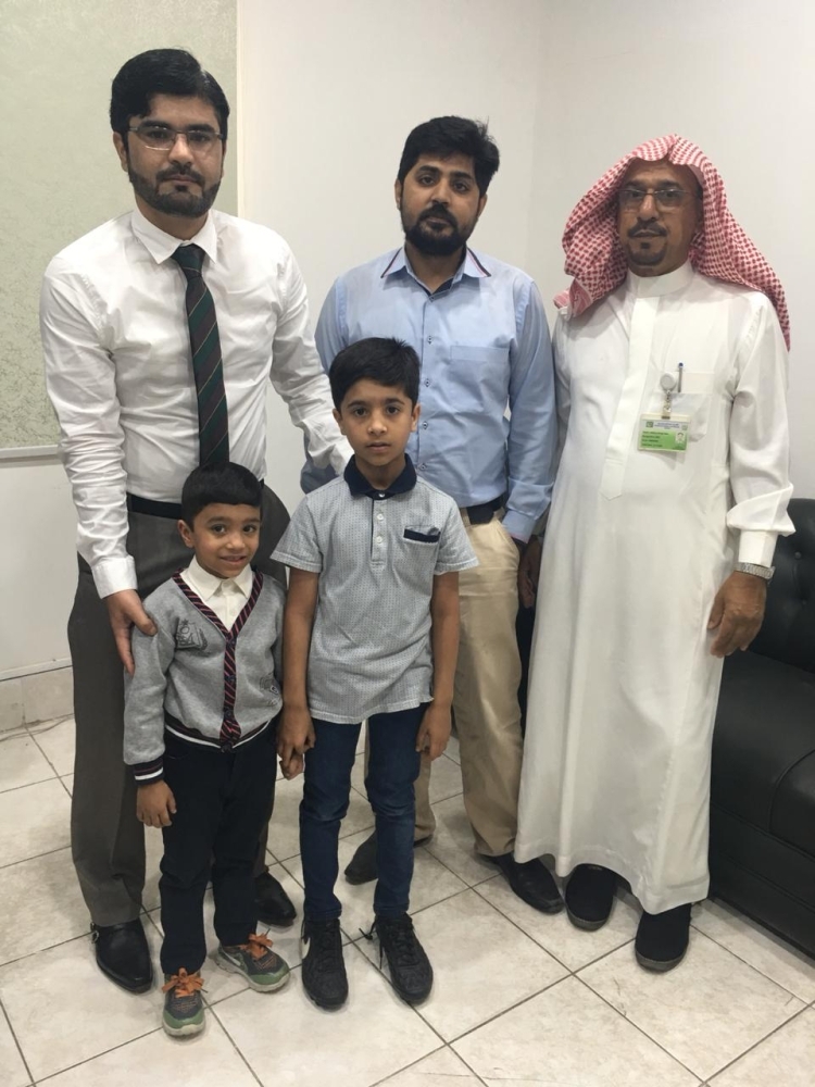 


Mohammed Ayyan, 9, and Abdul Manan, 6, with Najeebullah Khan Durrani, community welfare attache, and the consulate staff.