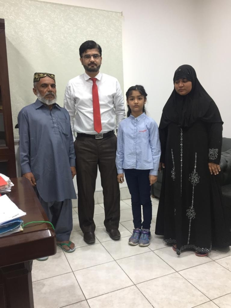 


Mohammed Ayyan, 9, and Abdul Manan, 6, with Najeebullah Khan Durrani, community welfare attache, and the consulate staff.