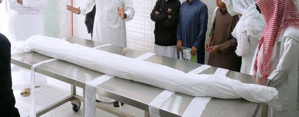 


The schoolteacher takes children to witness the washing of the dead to demonstrate to them how to prepare the body for burial.