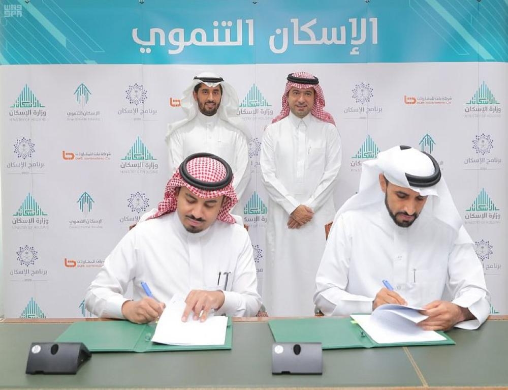 Minister of Housing Majed Al-Huqail supervises the signing of an agreement to build housing units. — SPA