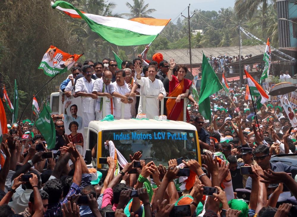 Rahul Gandhi, president of India’s main opposition Congress party, and his sister a leader of Congress party Priyanka Gandhi Vadra, wave to their supporters after Rahul filed his nomination papers for the general election, in Wayanad in the southern state of Kerala, India, on Thursday. — Reuters