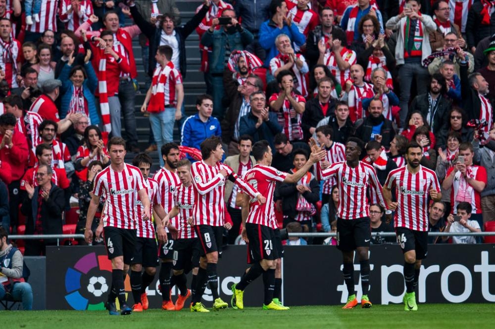 Athletic Bilbao celebrate their side's goal against Levante to move within four points of fourth spot in La Liga. — AFP