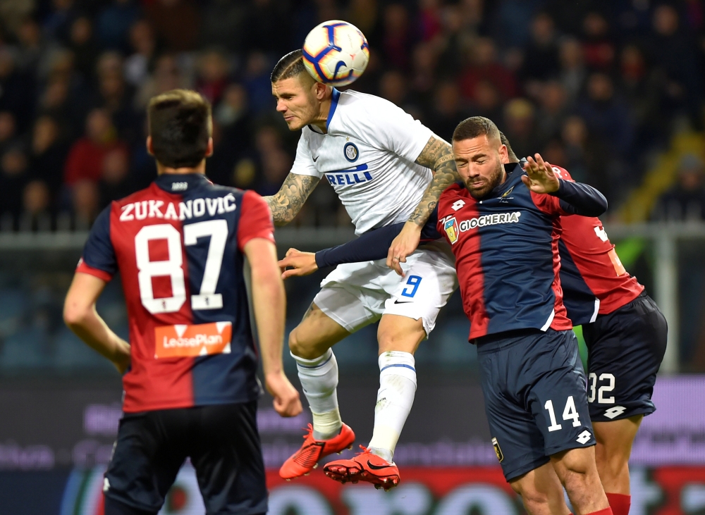 Inter Milan's Mauro Icardi in action with Genoa's Davide Biraschi during the Serie A match at the Stadio Comunale Luigi Ferraris, Genoa, Italy, on Wednesday. Reuters  