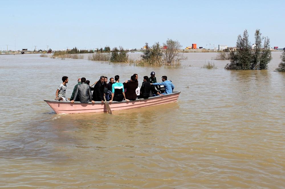 People are seen on a boat after a flooding in Golestan province, Iran, in this March 24, 2019 file photo. — Reuters  