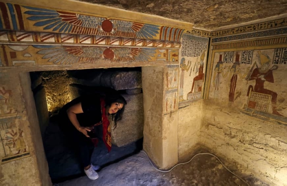 A tourist enters the newly discovered tomb of Tutu near Sohag, Egypt, on Friday. — Reuters