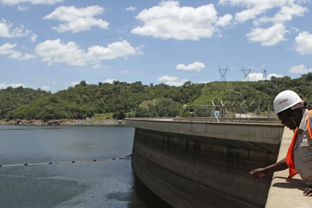 An official of the Zimbabwe Electricity Supply Authority inspects water levels on the Kariba Dam in Zimbabwe. Between October 2018 and February 2019, the level of Lake Kariba fell by over 3m. — Reuters 