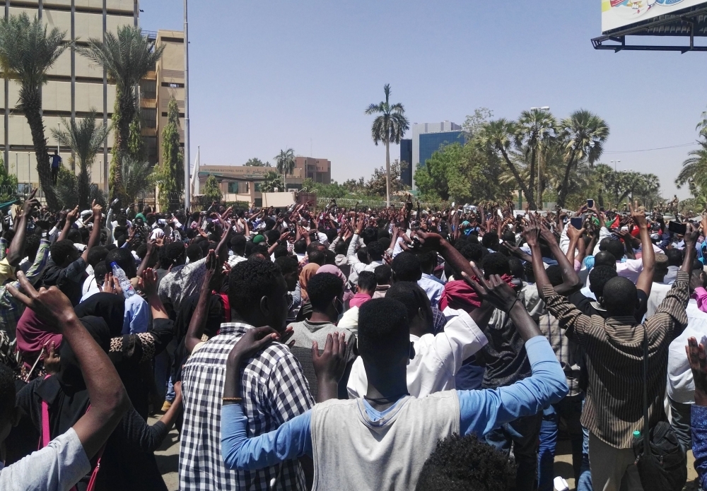 Sudanese protesters gather in protest outside the military headquarters in the capital Khartoum on Sunday.  — AFP