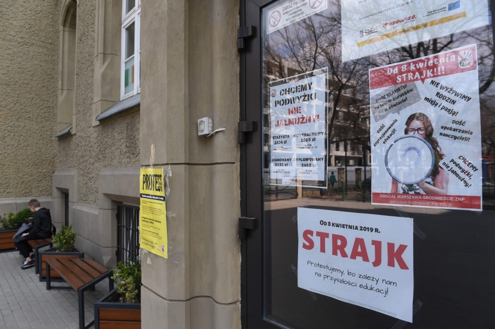 Posters declaring the participation at the indefinite nationwide teachers’ strike at a school in Warsaw on Monday. — AFP