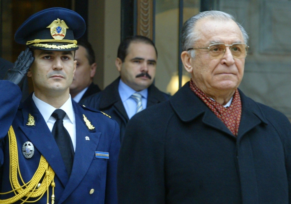 Former President of Romania, Ion Iliescu, right, attends an official ceremony as Iliescu leaves the Cotroceni Palace, the Romanian presidency headquarters in Bucharest, Romania, in this Dec. 21, 2004 file photo. — AFP