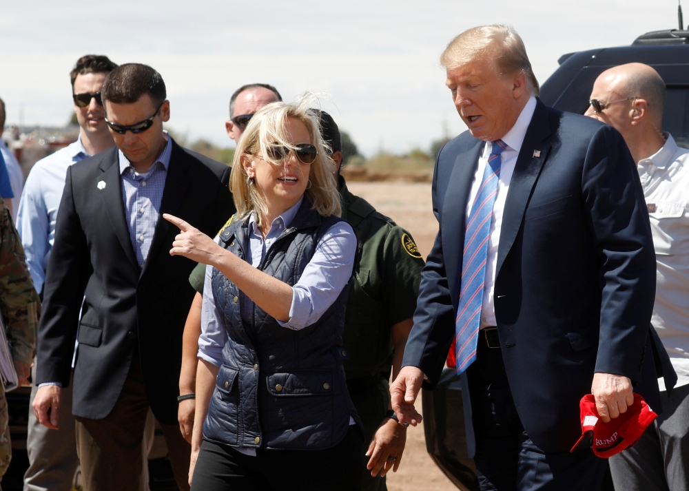 Homeland Security Secretary Kirstjen Nielsen, center, and commissioner for Customs and Border Patrol Kevin McAleenan, left, walk with US President Donald Trump during a visit to a section of the border wall in Calexico, California, in this April 5, 2019 file photo. — Reuters