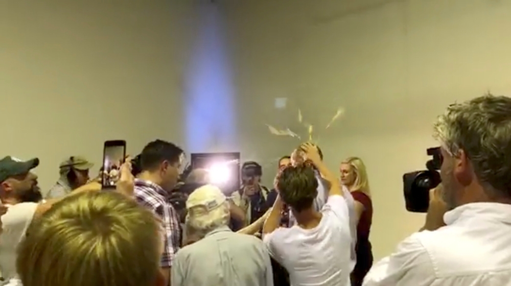 Australian Senator Fraser Anning has an egg smashed on his head while talking to the media in Victoria, Australia March 16, 2019 in this still image taken from a video obtained from social media. THE UNSHACKLED/via REUTERS  ATTENTION EDITORS - THIS IMAGE HAS BEEN SUPPLIED BY A THIRD PARTY. MANDATORY CREDIT. NO RESALES. NO ARCHIVES.