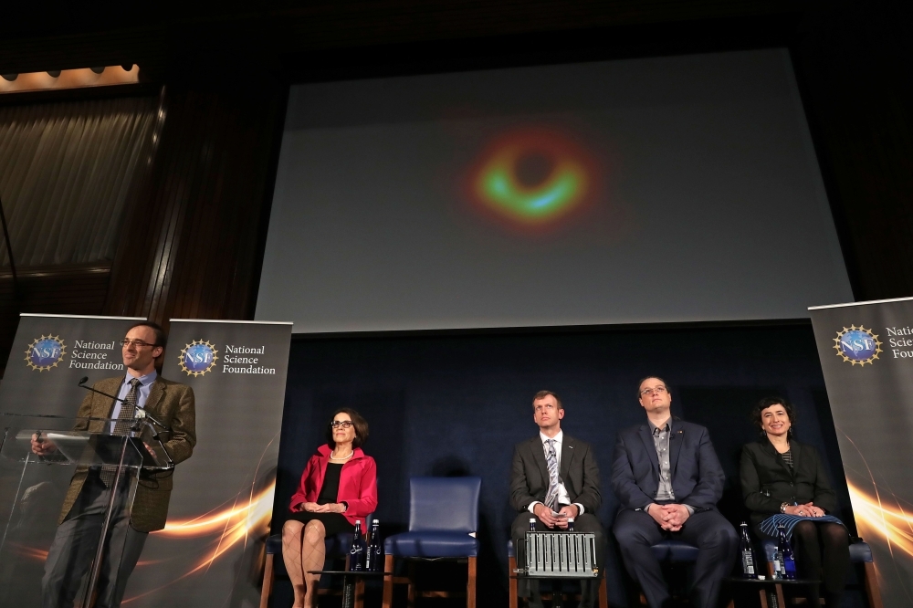 The first ever photo a black hole, taken using a global network of telescopes, conducted by the Event Horizon Telescope (EHT) project, to gain insight into celestial objects with gravitational fields so strong no mater or light can escape, is shown in this handout photo released on Wednesday. — Reuters
