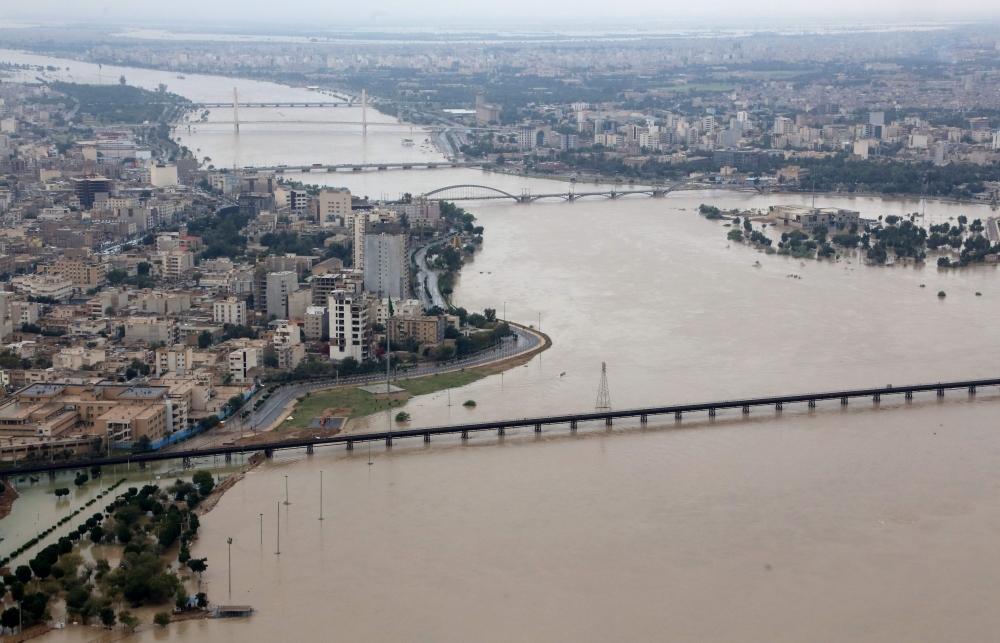 An aerial view taken on Tuesday shows the Karun River which has burst its banks in Ahvaz, the capital of Iran’s southwestern province of Khuzestan which has been badly affected by flooding over the past few weeks. — AFP