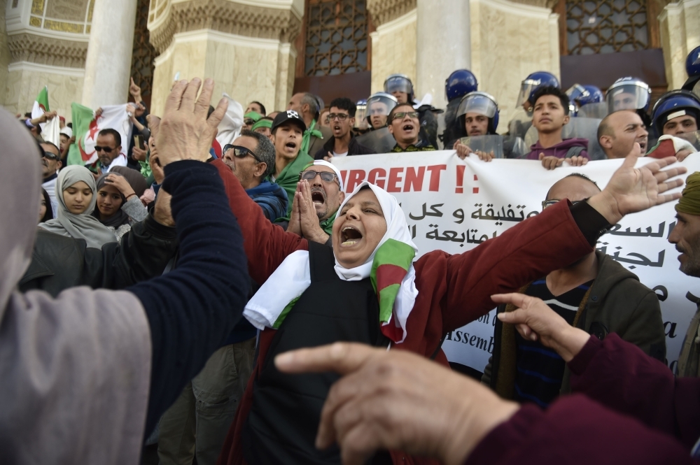 Algerian protesters shout slogans during an anti-system demonstration in the capital Algiers on Wednesday, one day after Algerian lawmakers appointed regime stalwart Abdelkader Bensalah as the country's interim president, dismaying protesters seeking sweeping change following the resignation of veteran leader Abdelaziz Bouteflika.  — AFP