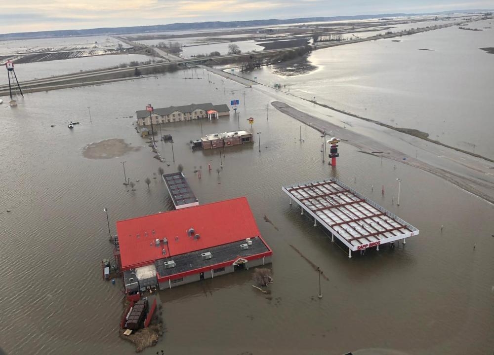 A motel, restaurant and travel stop are shown surrounded by flood waters in this aerial photo in Percival, Iowa, in this March 29, 2019 file photo. — Reuters