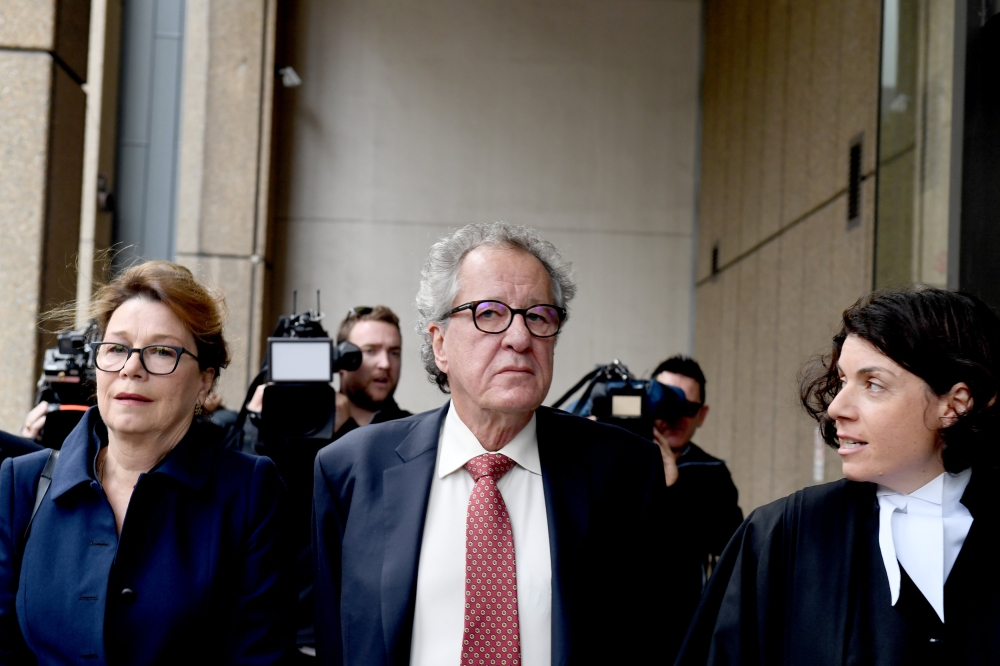 Australian actor Geoffrey Rush, center, arrives at the Supreme Court in Sydney, Australia, on Thursday. — Reuters